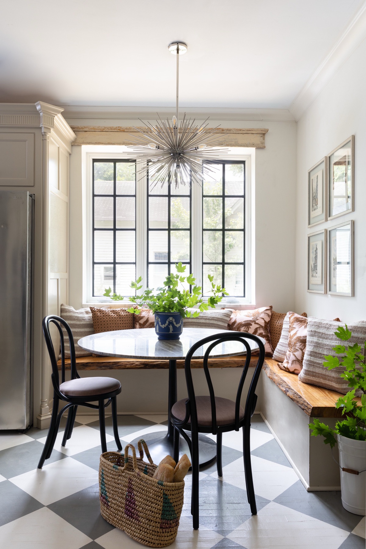 Breakfast nook with banquette seating and steel windows