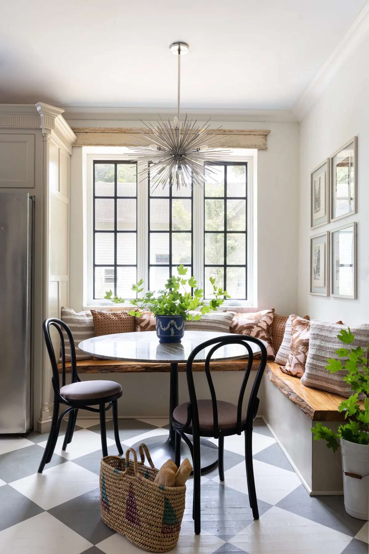 Breakfast nook with banquette seating and steel windows