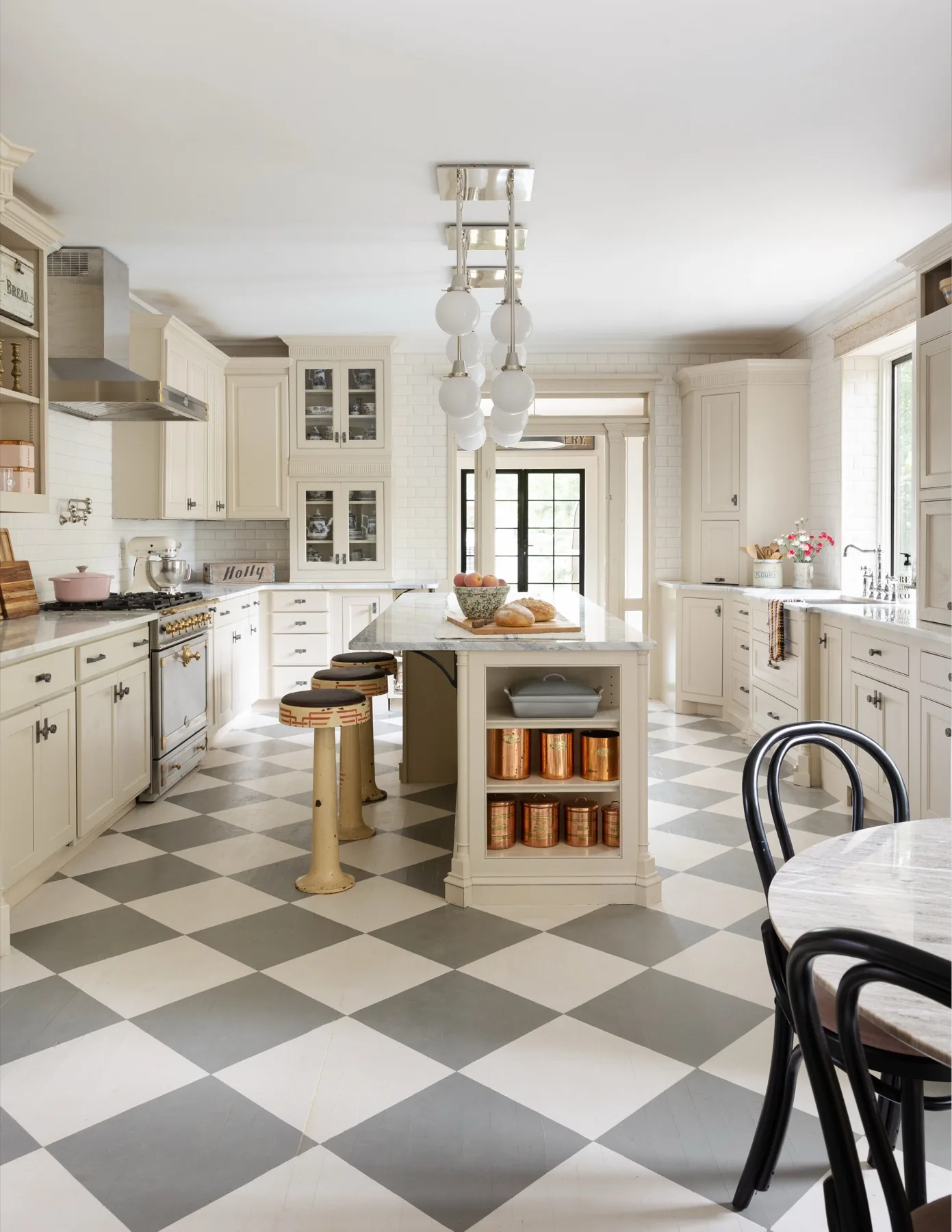Kitchen with marble backsplash and a La Cornue range