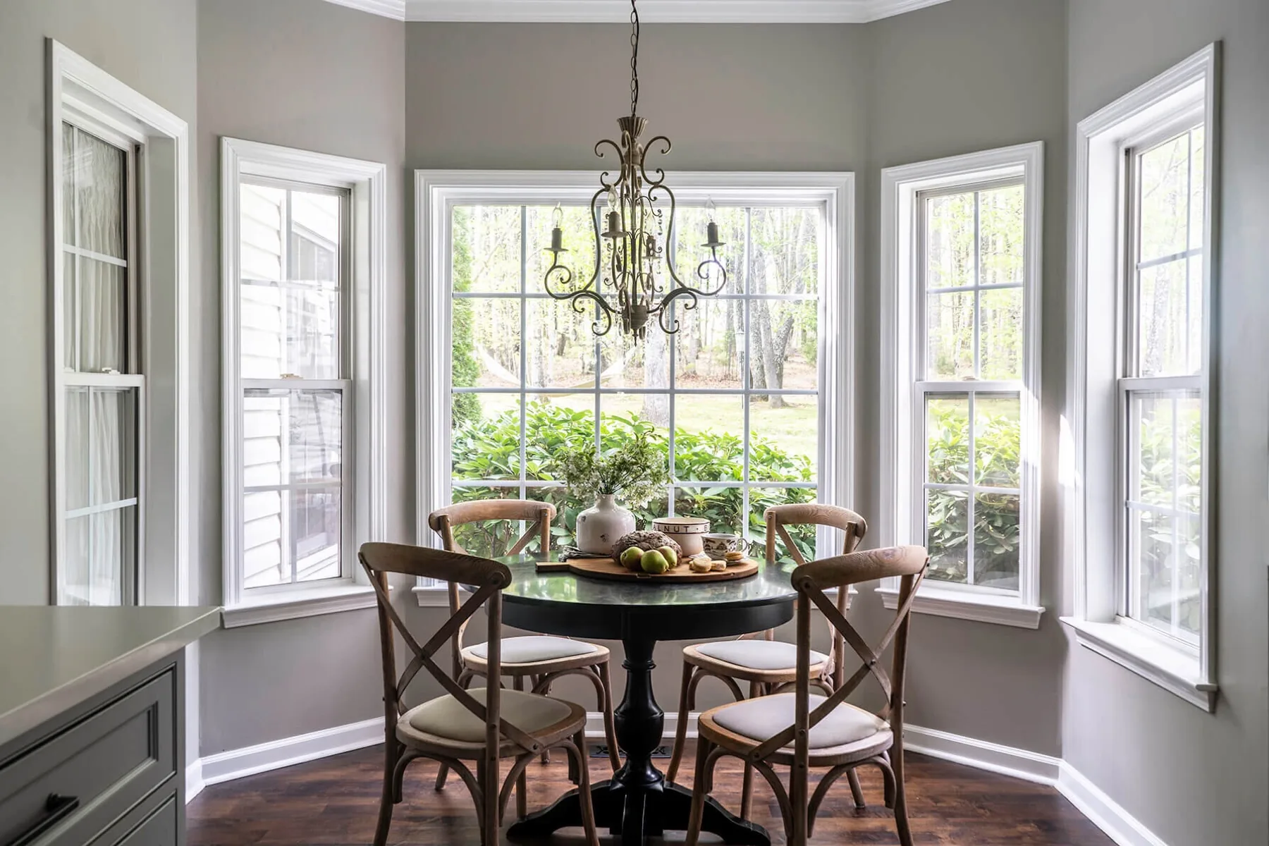Breakfast nook with bay windows and a round pedestal table
